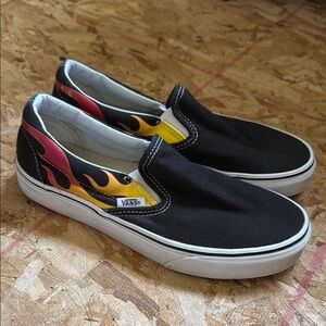 Vans Black Slip-Ons with Red and Yellow Flame Accents